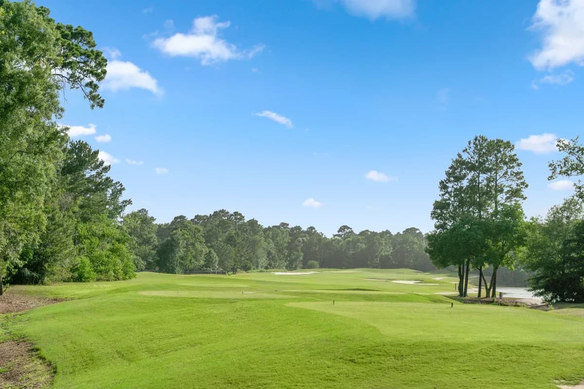 A tree-lined golf course fairway